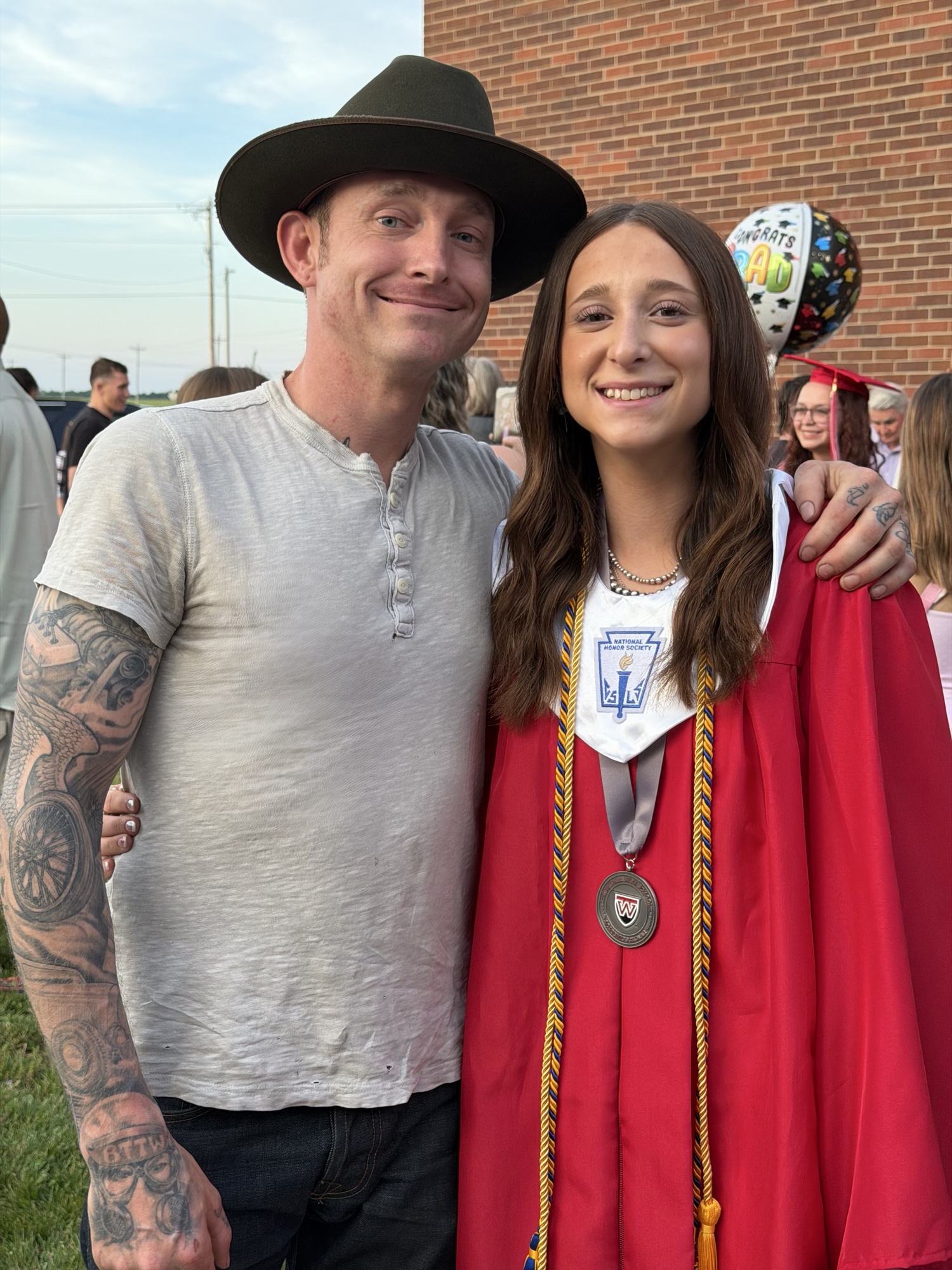 Justin and his daughter at her graduation.