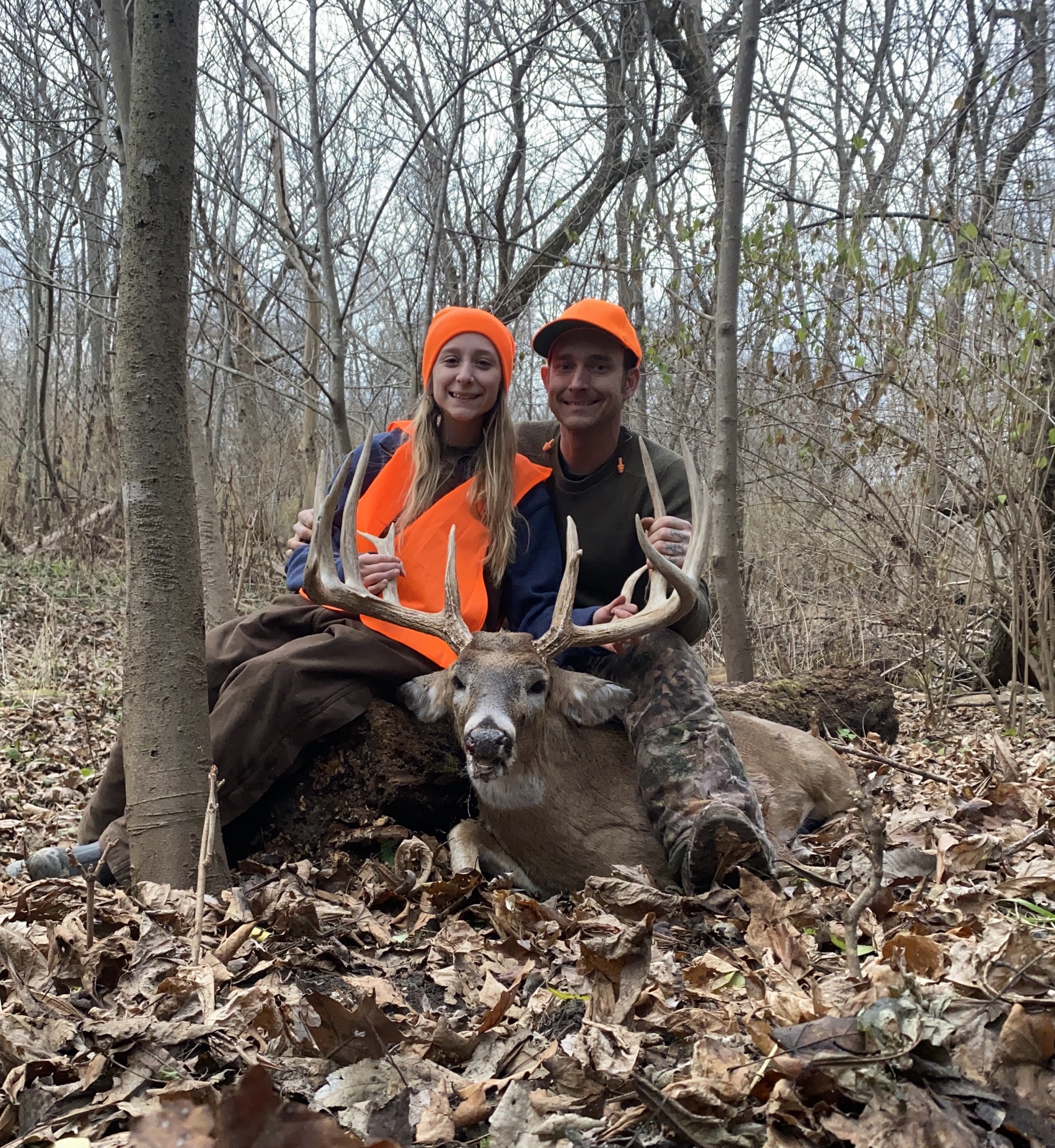 Justin and his daughter with a whitetail buck.