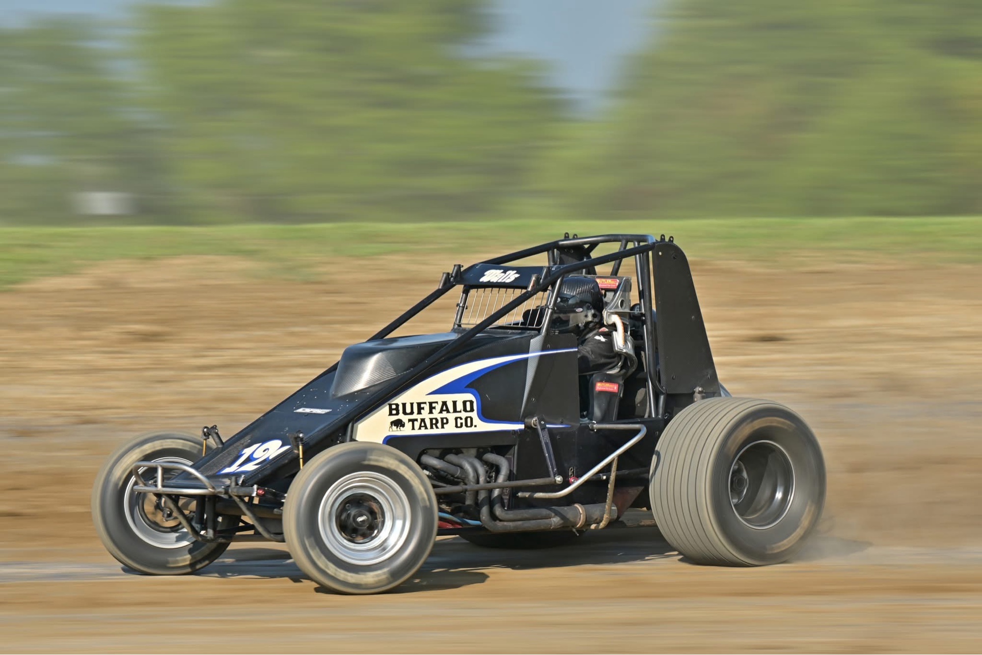Buffalo Tarp Co. sprint car #12 on the dirt.