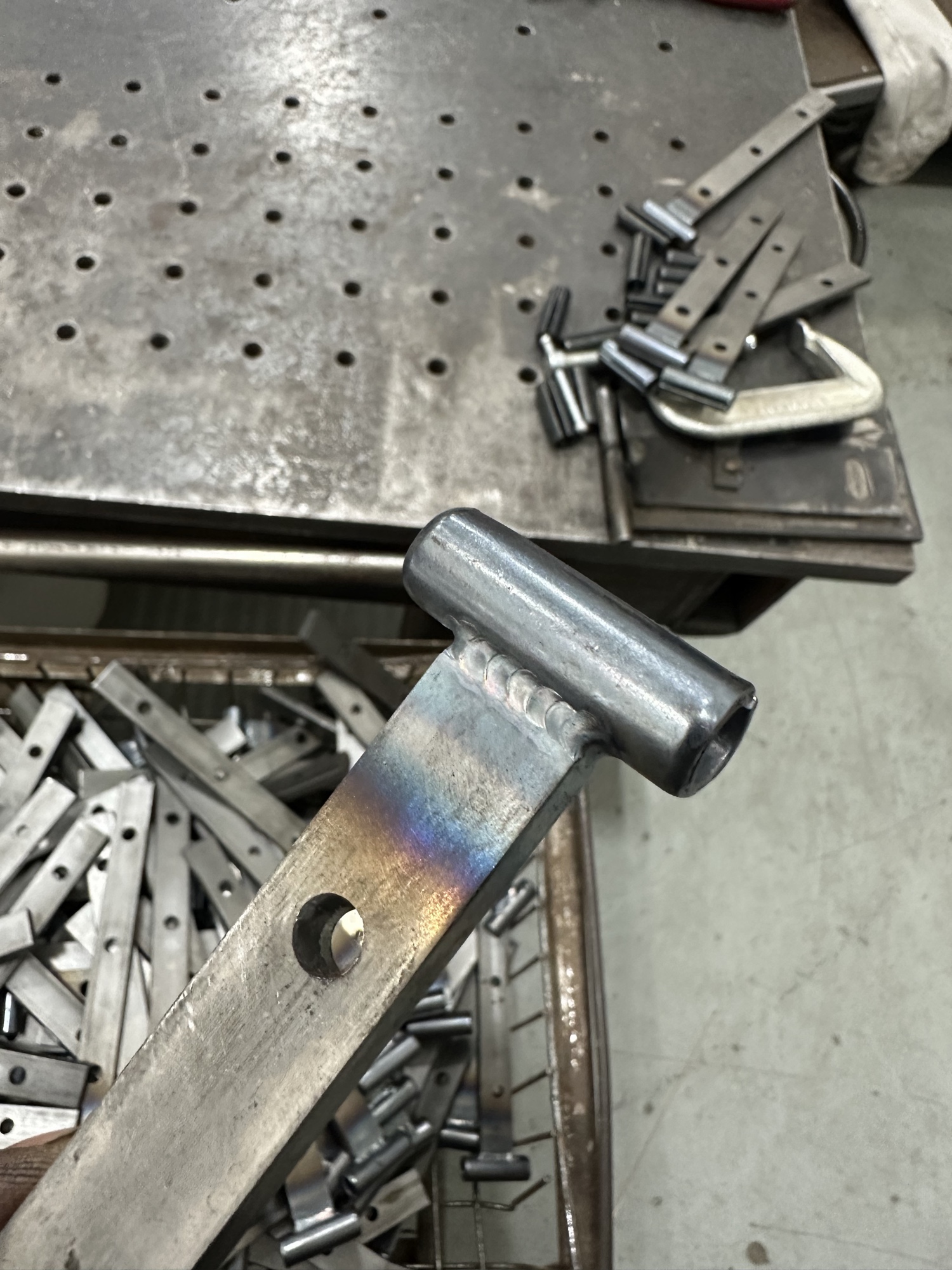 Brackets and hardware laid out on a shop fixture table.