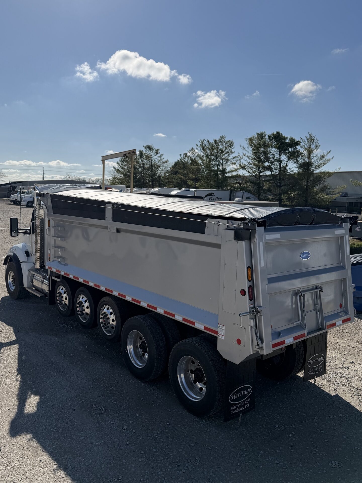 Buffalo Tarp system deployed over a loaded dump bed.