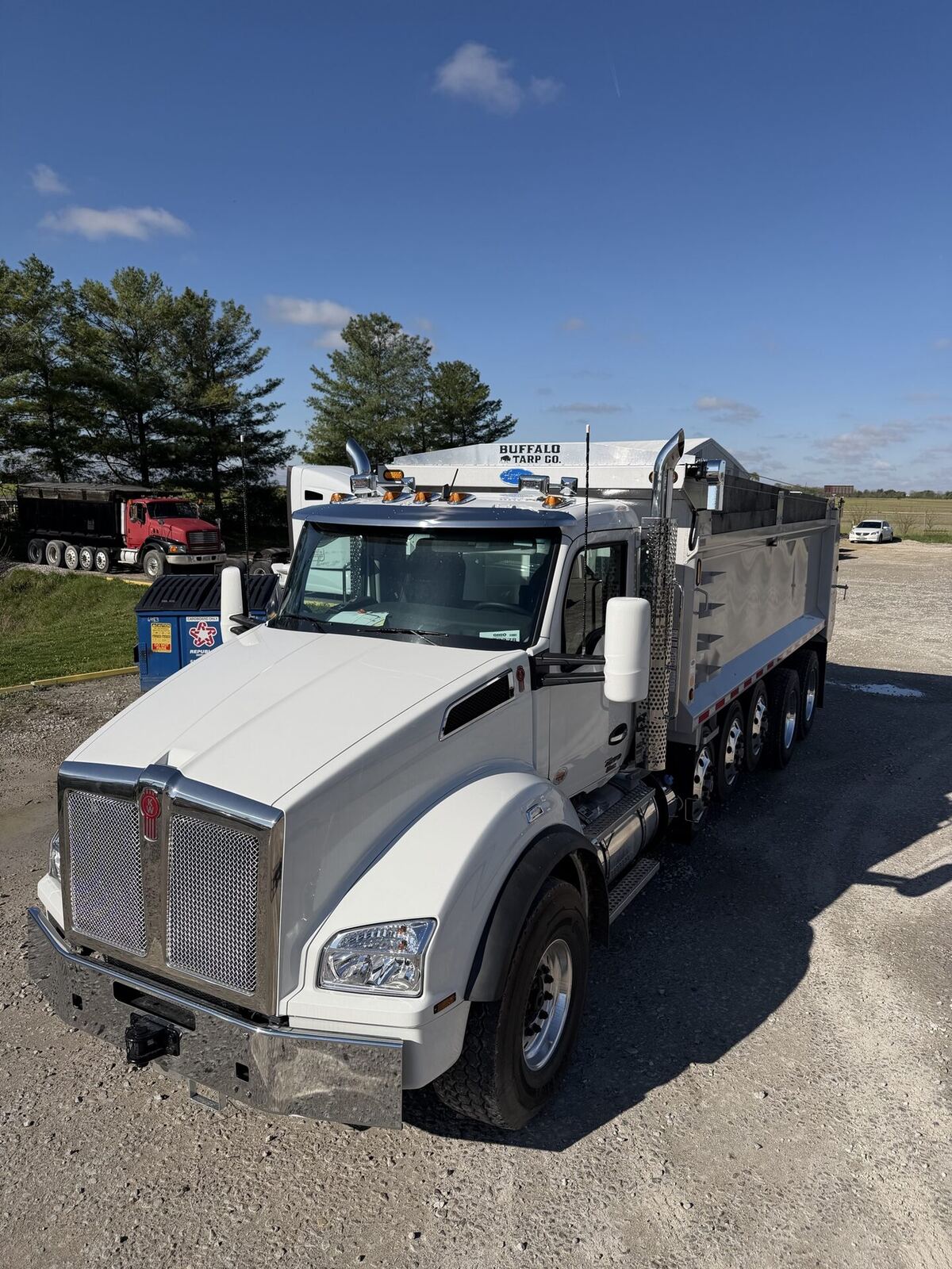White Kenworth dump truck with Buffalo Tarp system.